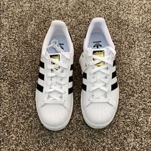 Boys adidas Superstar J sneakers.